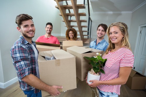 Removal team using safe lifting practices during a move