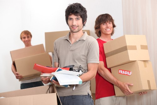 Commercial moving team handling office equipment