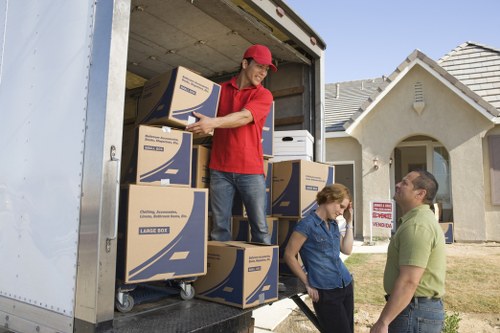 Organised moving process showing furniture and packed items in transit