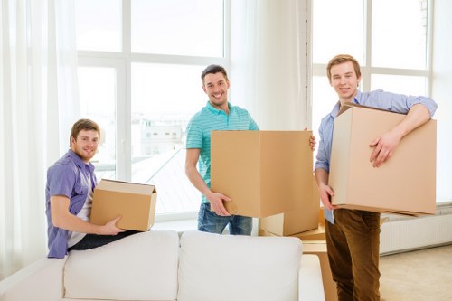 Professional movers handling furniture during a Dulwich home relocation