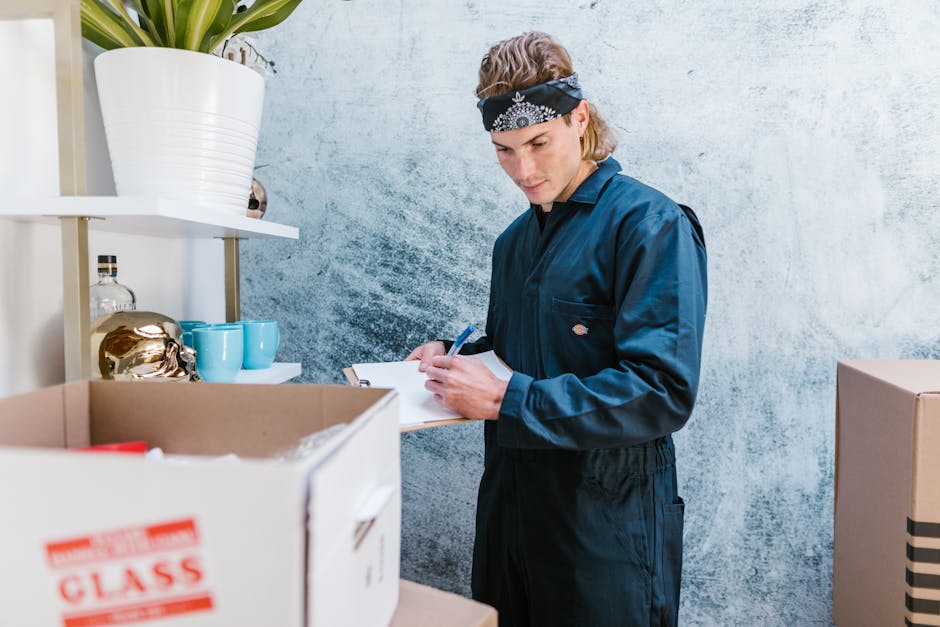 Close-up of a person wearing a high-visibility yellow safety vest and a light blue shirt, holding a clipboard with a total home inspection checklist on it. The individual is grasping a black pen with 
